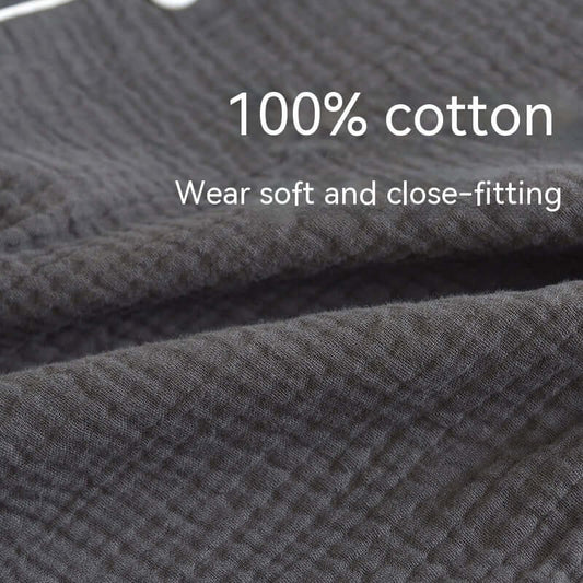 Close-up of black 100% cotton fabric highlighting softness and texture, perfect for breathable male pajamas in spring and autumn.