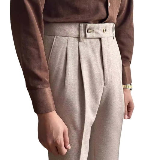 Elegant beige suit slacks paired with a brown shirt, showcasing style and versatility for formal or casual occasions.