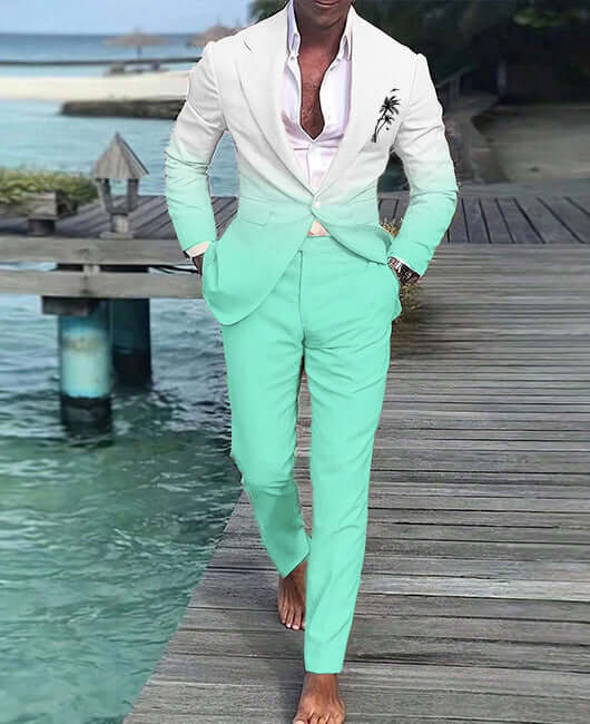 Man in a stylish summer suit walking on a wooden deck by the water, showcasing a modern blend of comfort and elegance.
