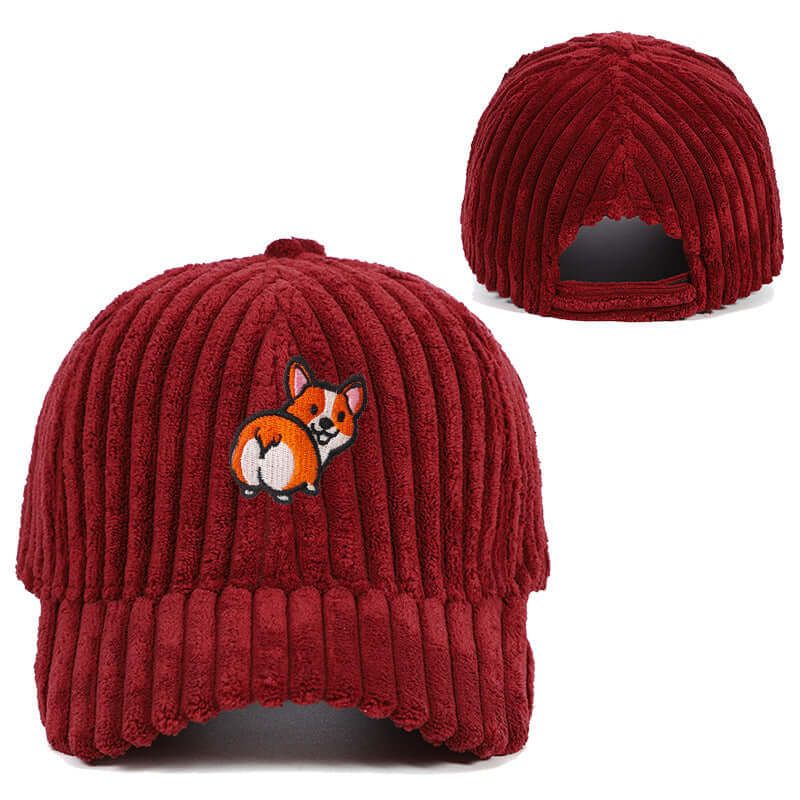 Red corduroy hat with cute embroidered dog design, showcasing a stylish accessory perfect for warmth and casual elegance.