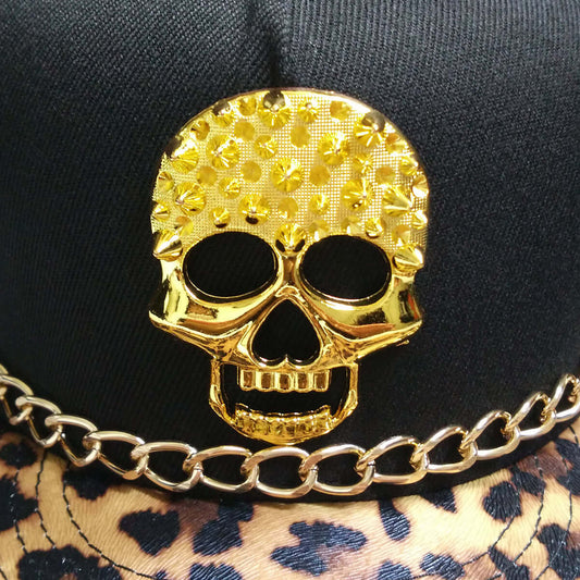 Trendy skull baseball hat with gold skull design and leopard print, perfect for edgy and stylish fashion lovers.