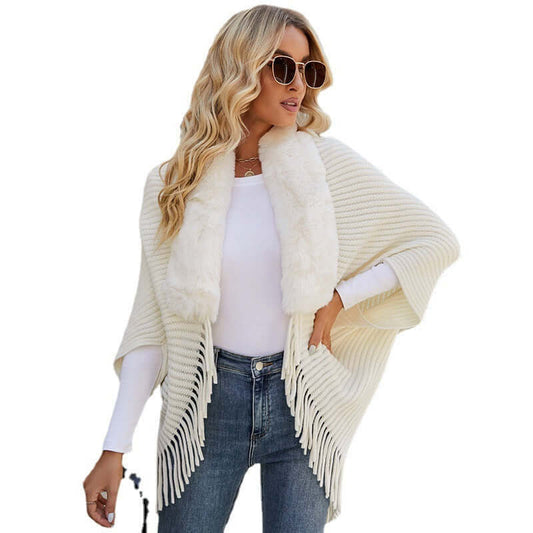 Elegant woman wearing a stylish Fur Jacket Shawl with fringe details and plush collar, perfect for any occasion.