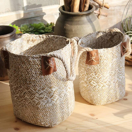 Set of hand woven baskets with decorative handles, perfect for eco-friendly storage and home decor.