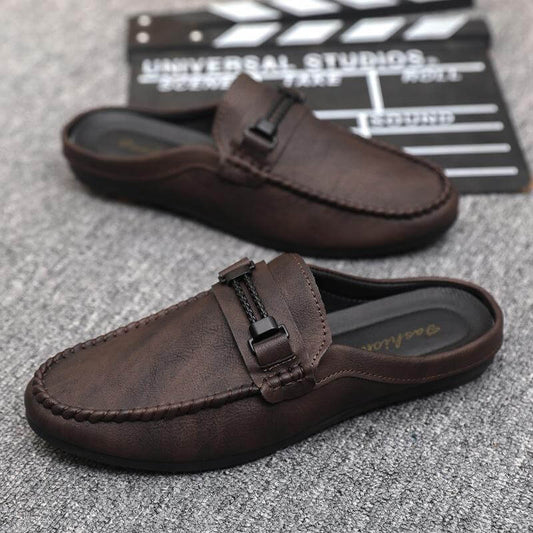 Brown open heel loafers with a rubber sole, showcasing stylish design and flexibility, perfect for any casual outfit.