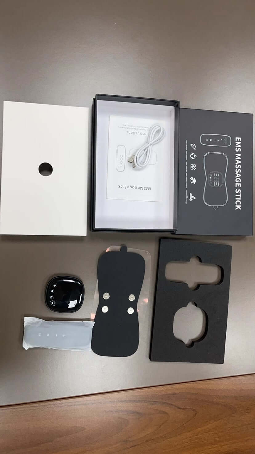 Unboxed neck and shoulder massager with remote and USB cable, designed for portable therapeutic relief and infrared therapy.