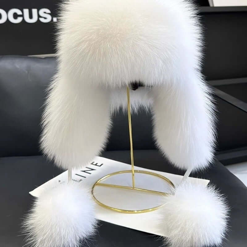 Ushanka Fur Hat in white, showcasing luxurious fur and chic ear flaps, perfect for winter elegance.