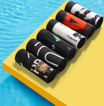 Assorted Ice Silk Underwear Pack displayed by the pool showcasing vibrant designs and premium fabric quality.