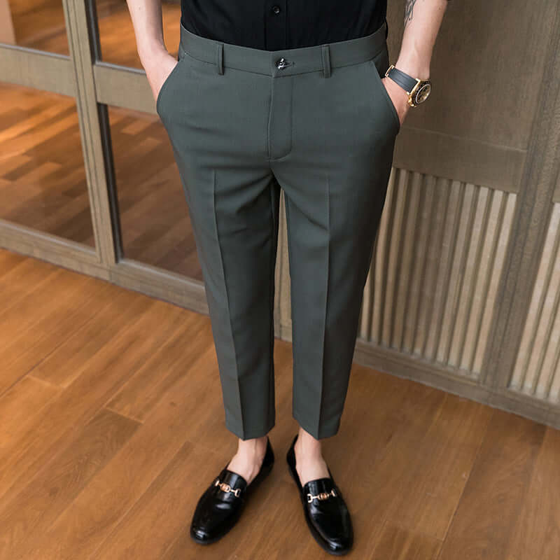 Business casual bottoms in dark green, styled with black loafers, perfect blend of style and comfort for the office.