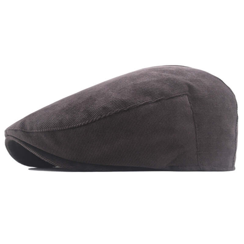 Classic Peaky Blinder Cap in dark fabric, showcasing timeless elegance and modern practicality for sophisticated style enthusiasts.