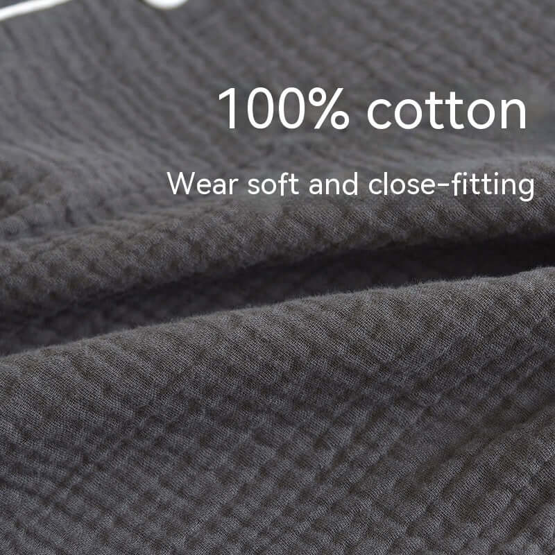 Close-up of black 100% cotton fabric highlighting softness and texture, perfect for breathable male pajamas in spring and autumn.