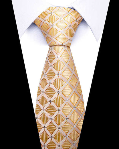 Close-up of gold patterned Business Professional Tie paired with a white shirt, perfect for elevating business attire.