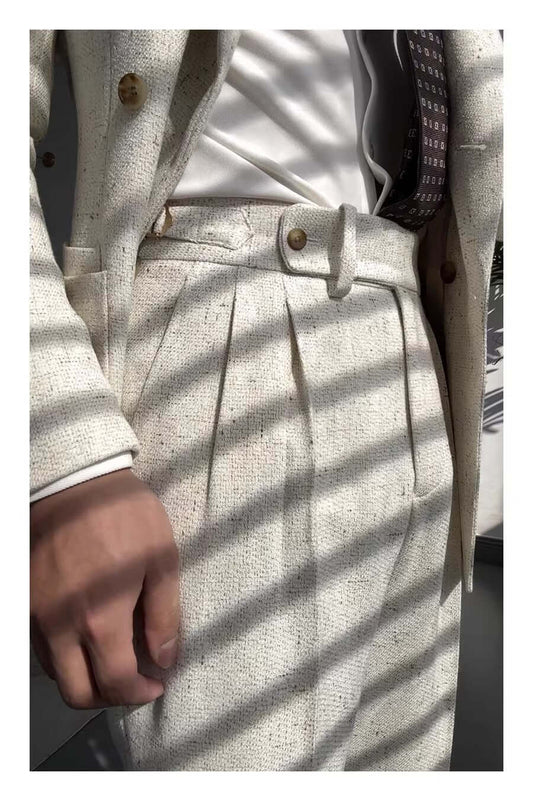 Close-up of stylish straight legged trousers in a cream color, perfect for versatile fashion and casual elegance.