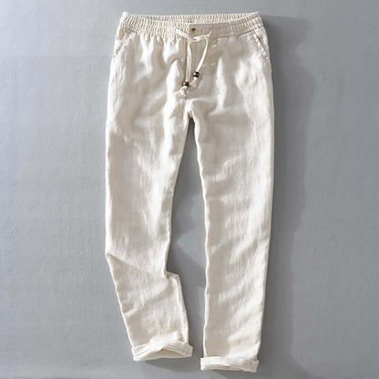 Cream-colored soft linen trousers for men, offering style and comfort, ideal for casual and semiformal summer occasions.