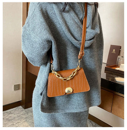 Stylish brown Crossbody Messenger Bag Purse worn with a gray outfit, featuring a gold chain and sleek PU material design.