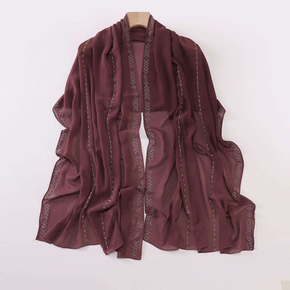 Elegant Ladies Chiffon Scarf in soft, airy fabric; fashionable burgundy wrap for versatile styling.
