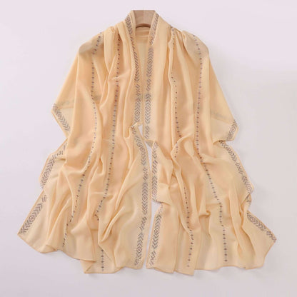 Elegant Ladies Chiffon Scarf in soft sandy yellow with delicate patterns, perfect for versatile styling and comfort.