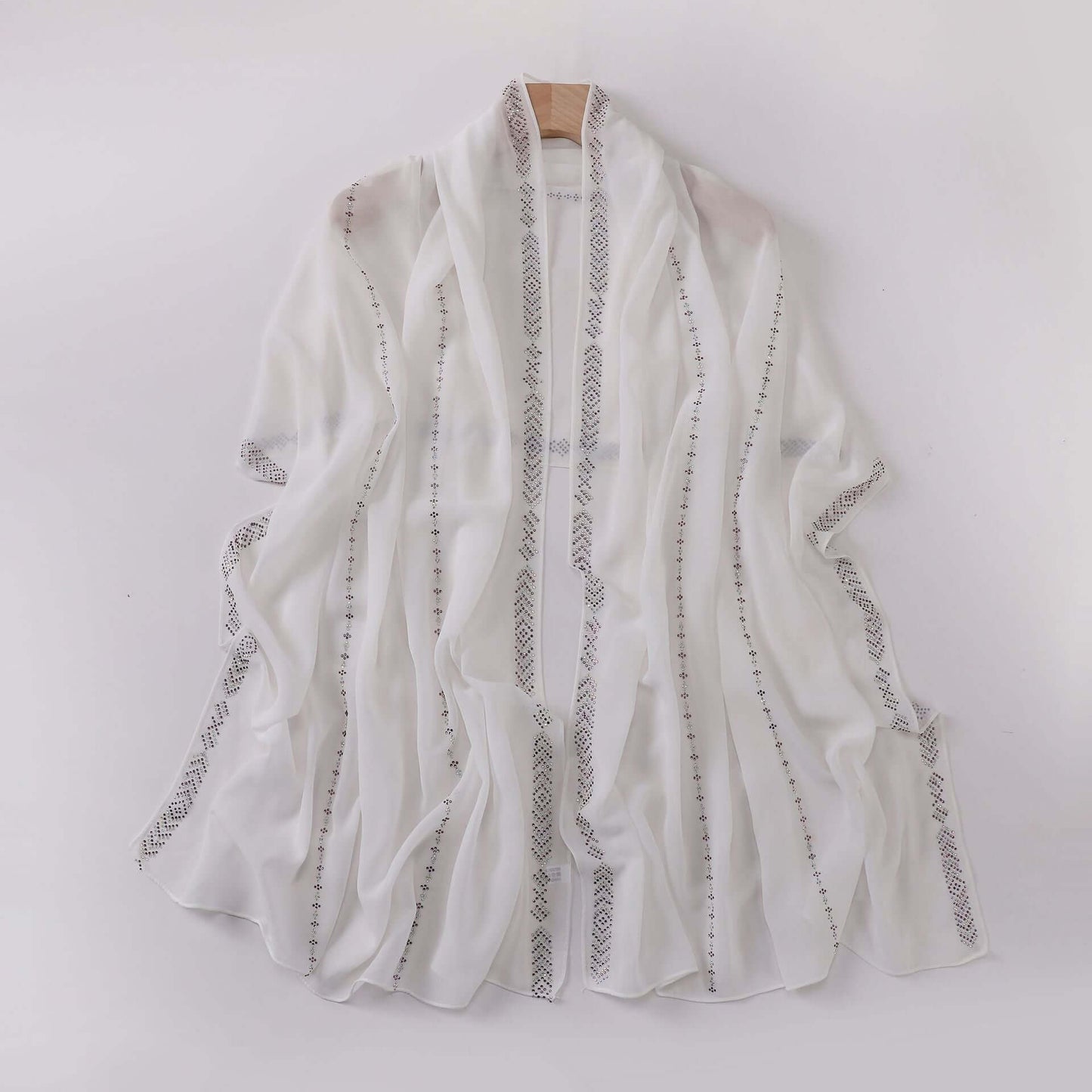Elegant Ladies Chiffon Scarf in white with delicate patterns, 175 x 70 cm, offering versatile styling and high-quality comfort.