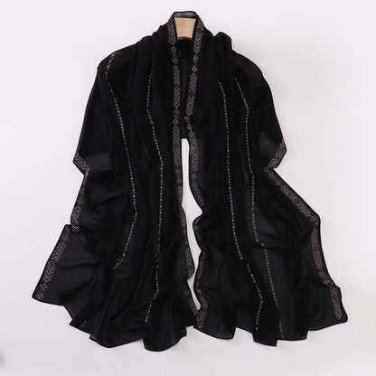 Elegant black chiffon scarf for ladies, versatile accessory for styling, made of soft high-quality material, 175x70 cm.