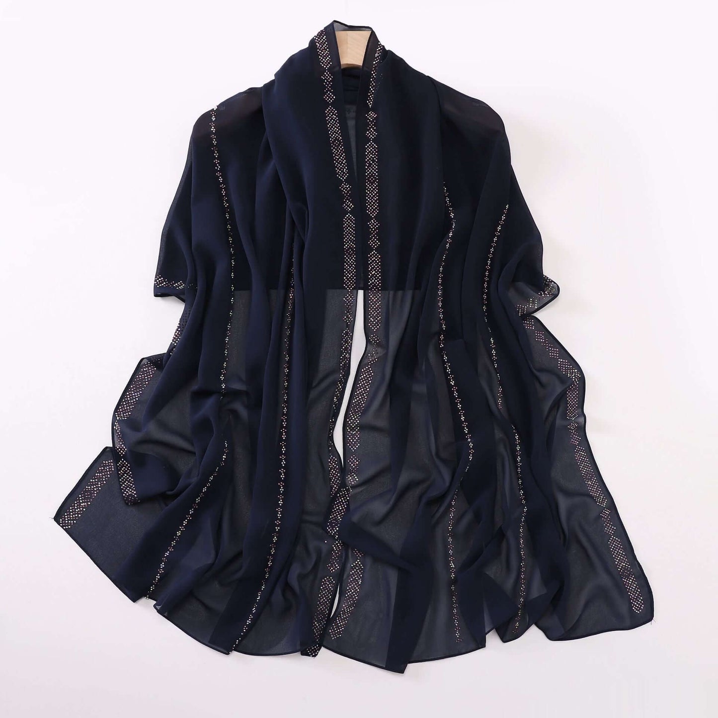 Elegant dark blue ladies chiffon scarf with delicate detailing, perfect for versatile styling. Soft and airy fabric. 175 x 70 cm.
