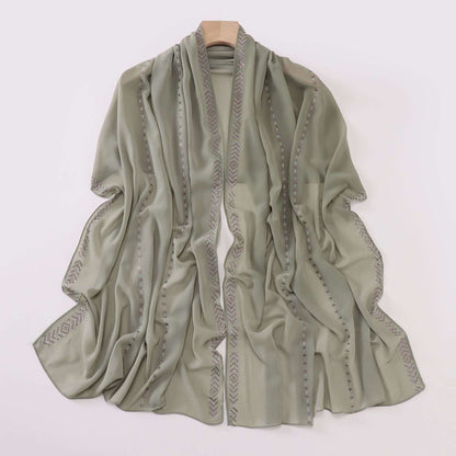 Elegant light green ladies chiffon scarf with intricate border design, 175 x 70 cm, made of soft and airy high-quality fabric.
