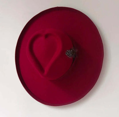 Heart Hat in rich red, featuring a unique heart shape and made from high-quality woolen fabric for warmth and durability.