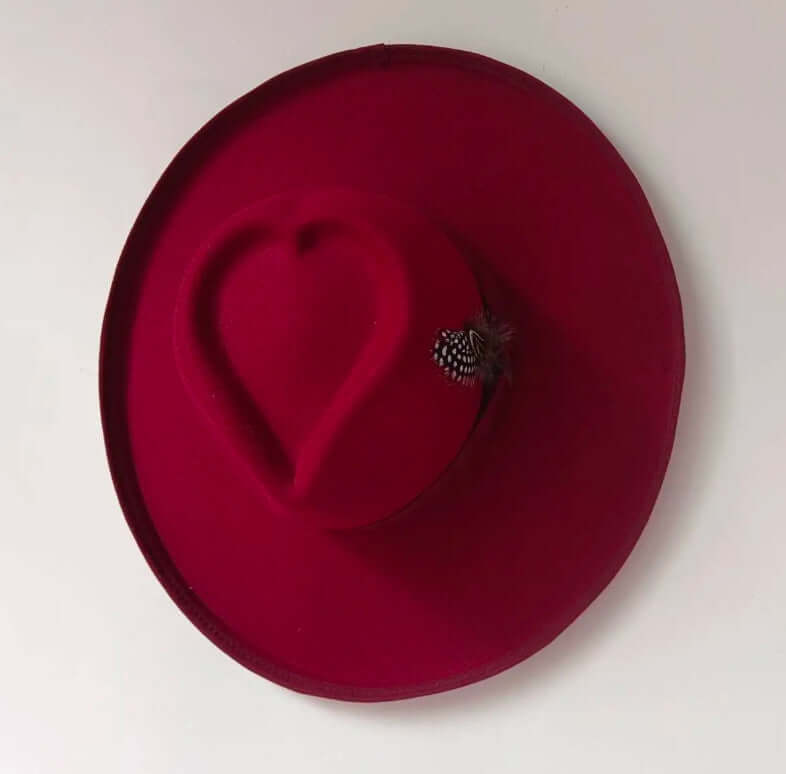 Heart Hat in vibrant red, made with durable woolen fabric for warmth, featuring warp knitting and satin processing for a stylish look.