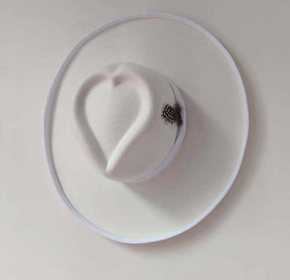 Heart Hat made of wool, featuring a heart shape on top, perfect for warmth and comfort in cold weather. Warp knitting and satin design.