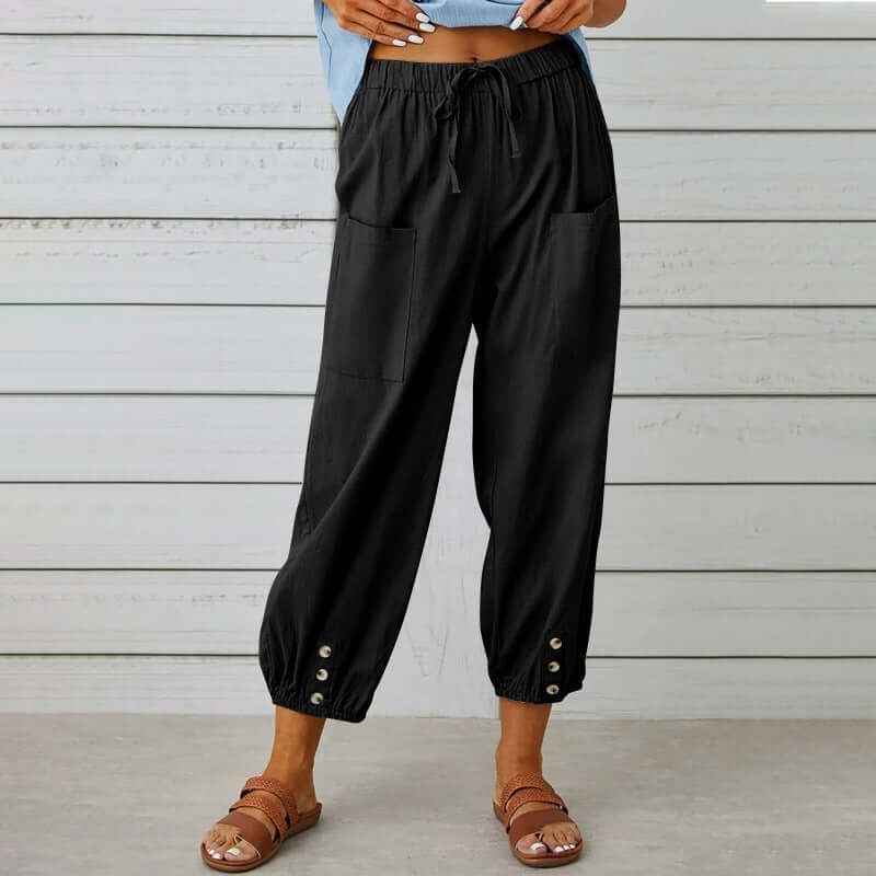 Ladies linen trousers in black, featuring comfortable cotton-linen blend, elastic waistband and buttons, perfect for breathable summer style.