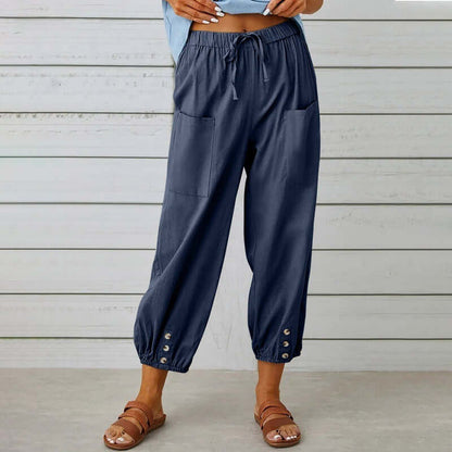 Ladies navy linen trousers with drawstring waist and button detail, crafted from a cotton-linen blend for breathable comfort.