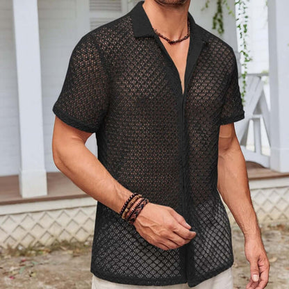Man wearing a sheer black fashion polo shirt, perfect for trendy and stylish outfits for any occasion.