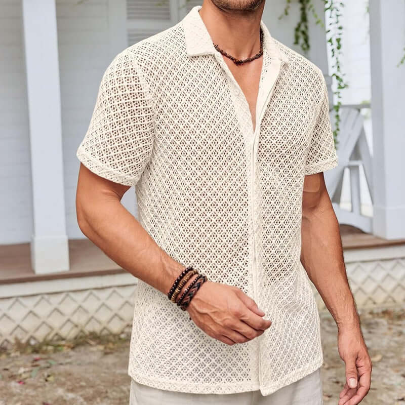 Man wearing a stylish crochet shirt, perfect for a casual summer day, showcasing intricate design and texture.