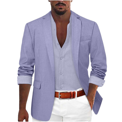Man wearing a stylish light blue leisure jacket with rolled sleeves, paired with a casual white shirt and pants.
