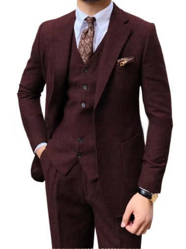 Man wearing elegant 3-piece herringbone suit, showcasing classic style and sophistication, perfect for formal occasions and stylish events.