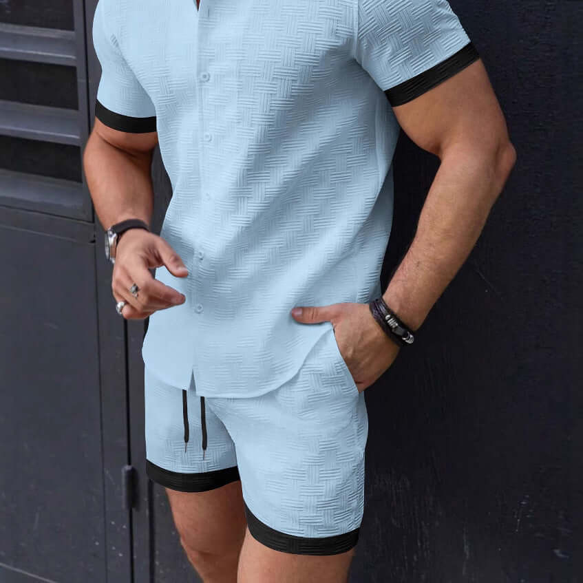 Man wearing stylish light blue Beach Attire Shorts set with black trim, ideal for casual outings and beachday comfort.