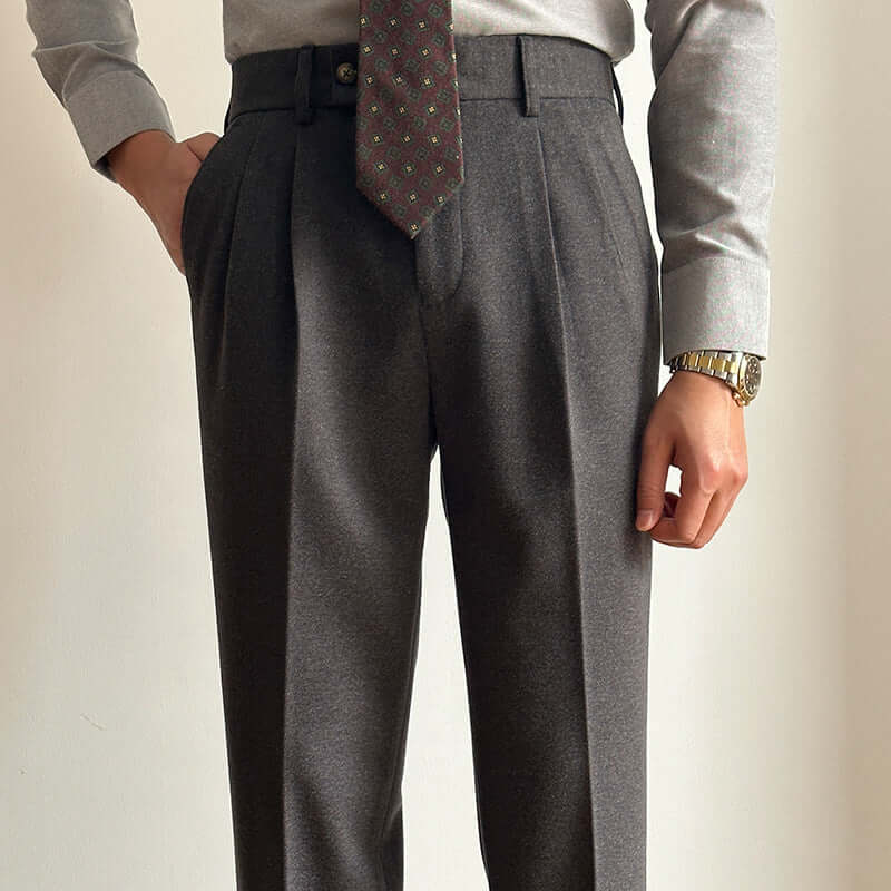 Man wearing stylish suit slacks, showcasing elegant formal attire for modern wardrobe essentials.