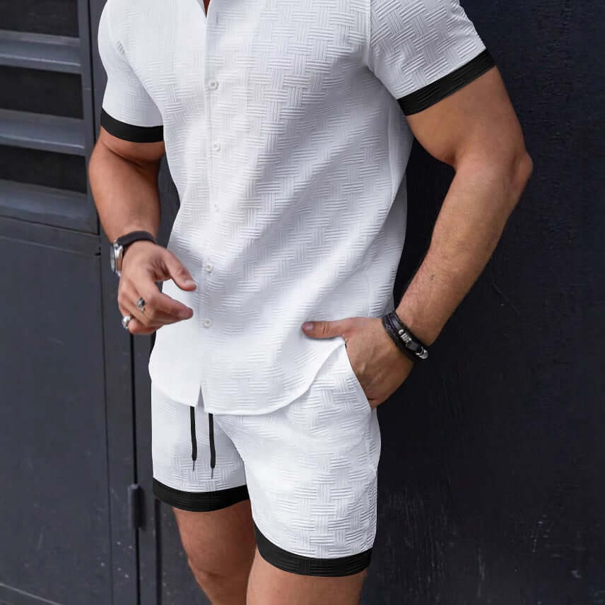 Man wearing stylish white Beach Attire Shorts and matching shirt, perfect for summer beach outings.
