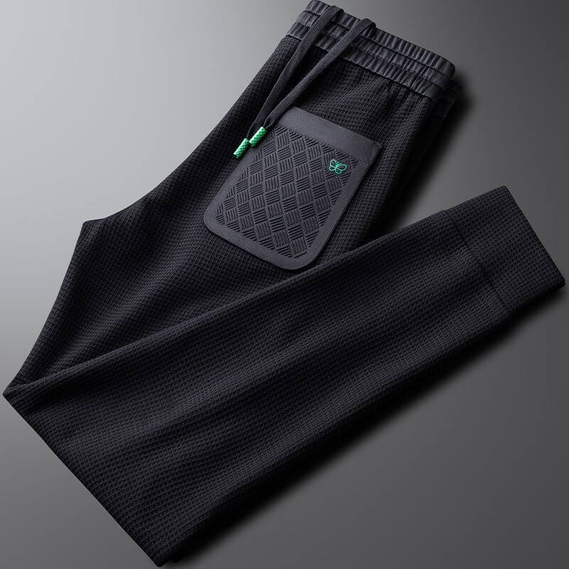 Premium men's sports trousers with pocket design, ideal for gym and casual wear, offering comfort and versatility.