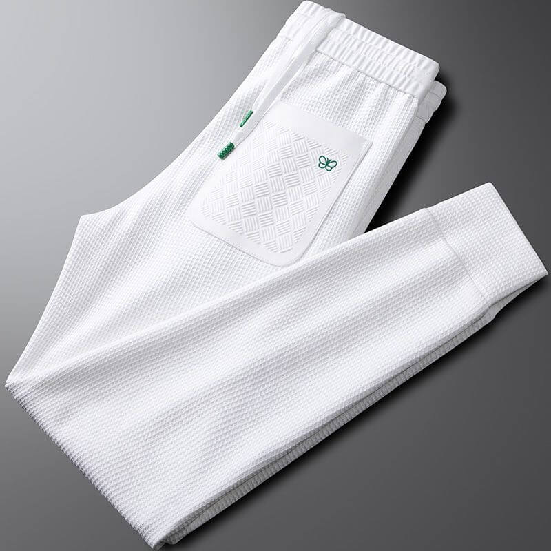 Premium white sports trousers for men, featuring a stylish pocket design, perfect for gym workouts and casual outings.