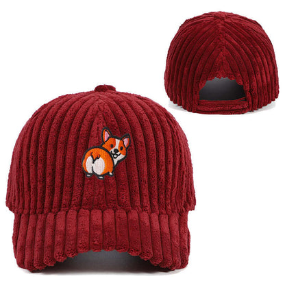 Red corduroy hat with cute embroidered dog design, showcasing a stylish accessory perfect for warmth and casual elegance.