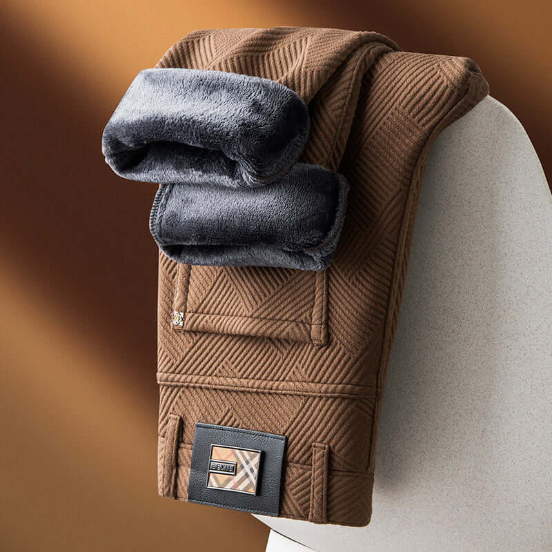 Stylish brown jacquard trousers folded with plush lining, showcasing trendy comfort and versatile style for everyday wear.