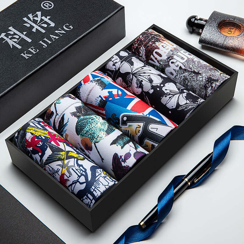Trendy Men Underwear Pack featuring vibrant patterns in a sleek black gift box, crafted from soft polyester for mid-waist comfort.
