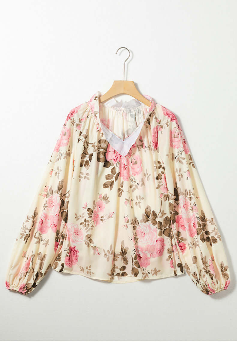 Floral V Neck Chiffon Blouse with pink and brown pattern, featuring long sleeves, on a hanger, perfect for elegant fashion.