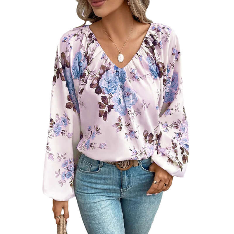 V Neck Chiffon Blouse with floral pattern in pastel colors, styled with blue jeans, showcasing elegant and comfortable fashion.