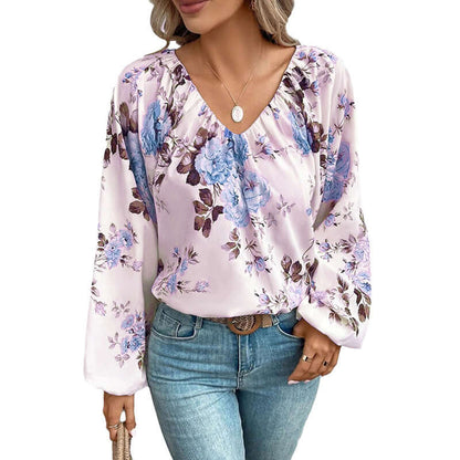 V Neck Chiffon Blouse with floral pattern in pastel colors, styled with blue jeans, showcasing elegant and comfortable fashion.