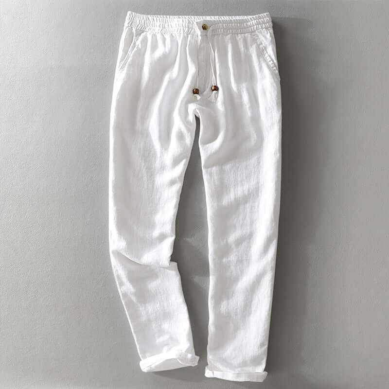 White soft linen trousers with drawstring detail for casual or semiformal style, perfect for summer comfort and breathability.