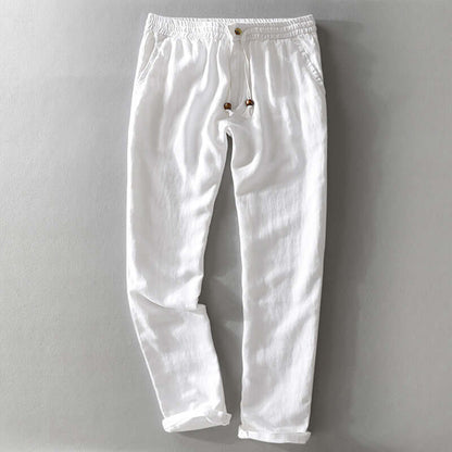 White soft linen trousers with drawstring detail for casual or semiformal style, perfect for summer comfort and breathability.