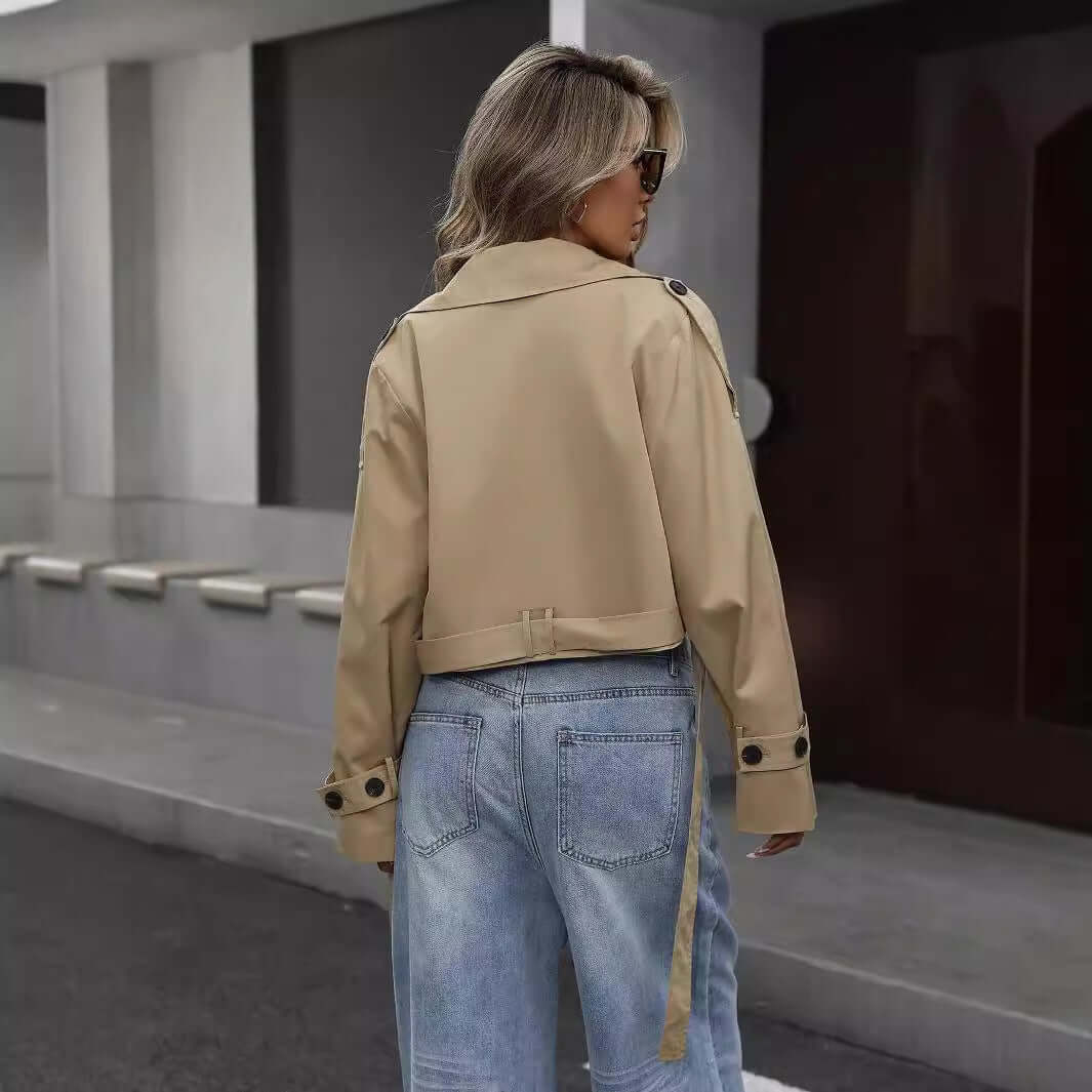 Woman wearing Ladies Casual Blazer in Khaki color, crafted from polyester for a stylish, durable look, paired with jeans outdoors.