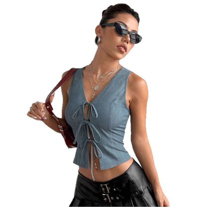Woman wearing a navy blue Front Lace Up Top, paired with sunglasses and accessories, showcasing a trendy sleeveless design.