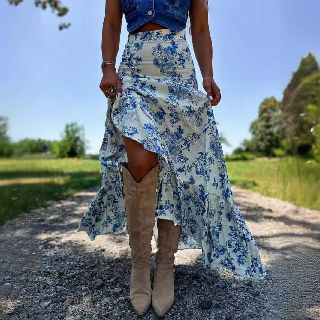 Woman wearing a pastoral Floral Skirt with vibrant flower prints and a 3D pattern, standing in a sunny outdoor setting.