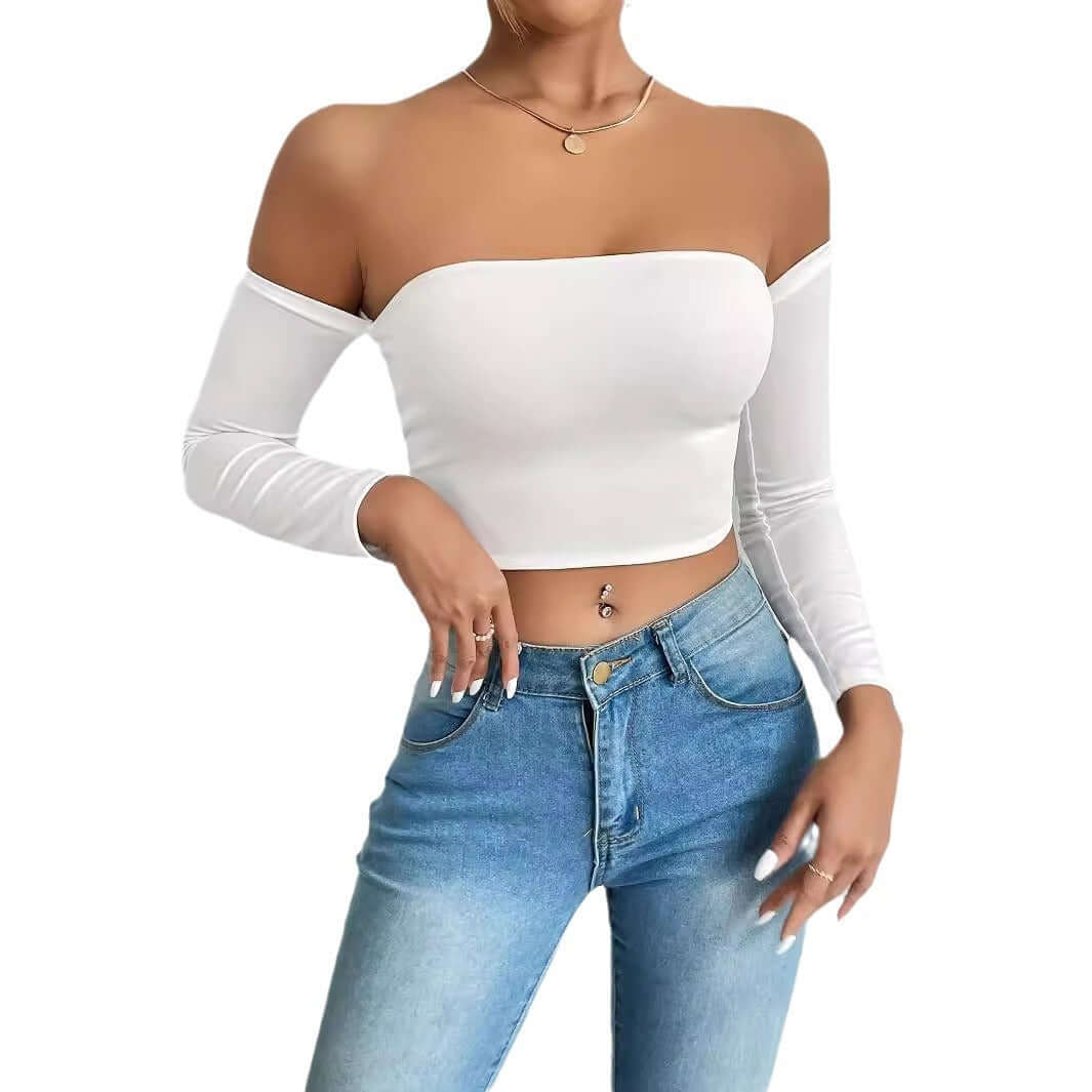 Woman wearing a white ladies camisole top with long sleeves, paired with blue jeans, showcasing a stylish and comfortable outfit.